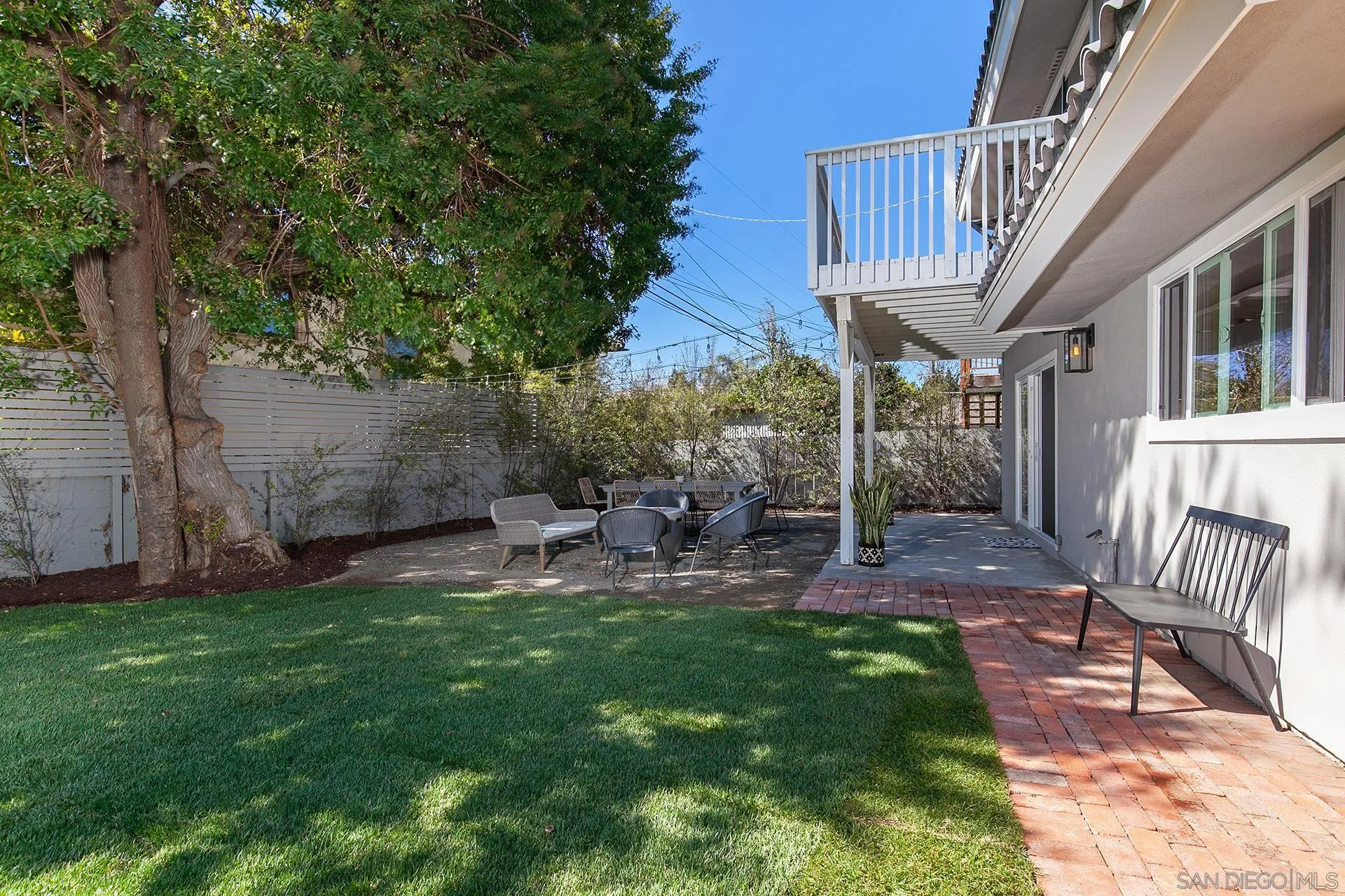 5238 La Jolla Boulevard San Diego, CA 92037 - Photo 25 of 46 a view of a chair and table in backyard of the house
