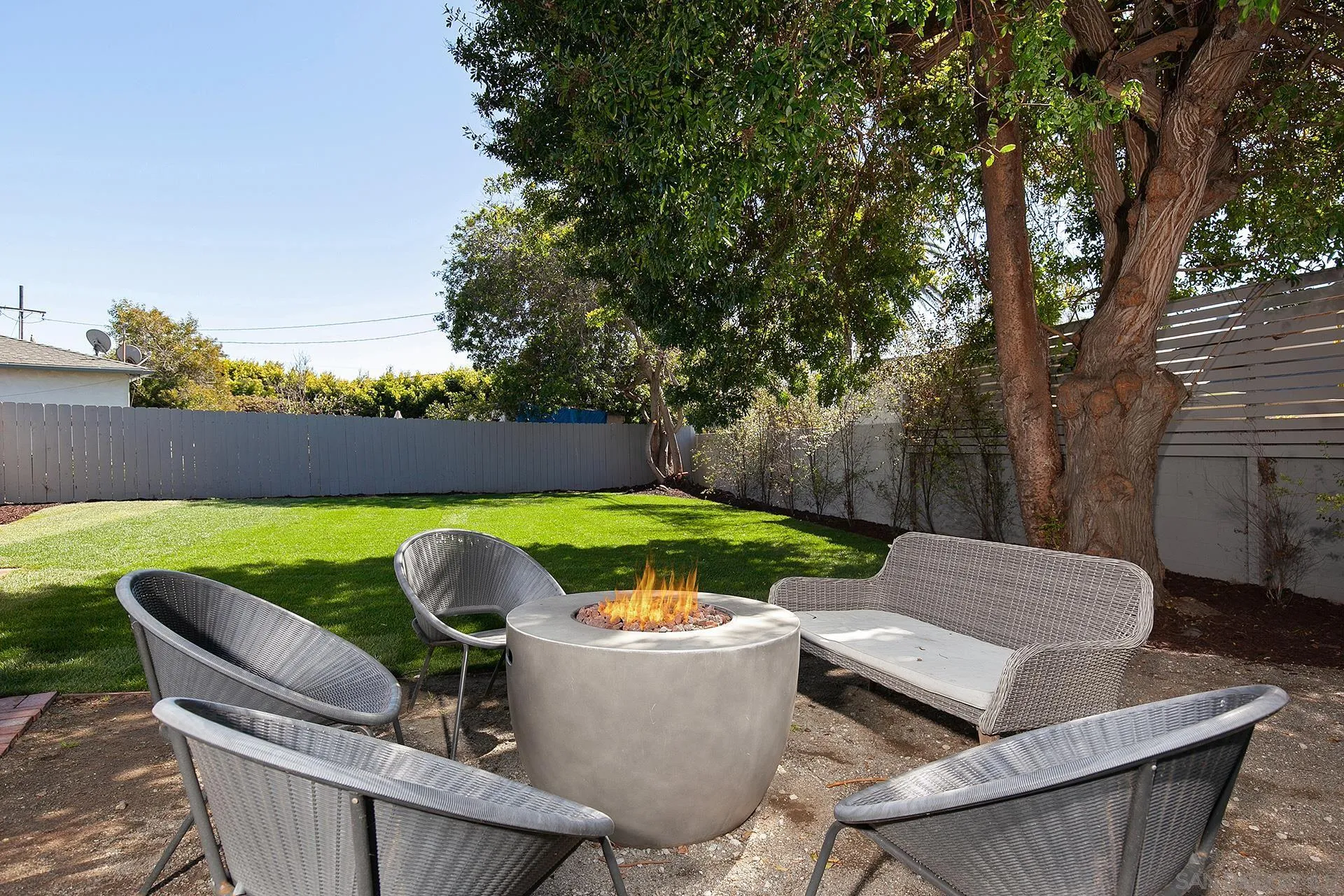5238 La Jolla Boulevard San Diego, CA 92037 - Photo 26 of 46 a view of backyard with seating space and trees