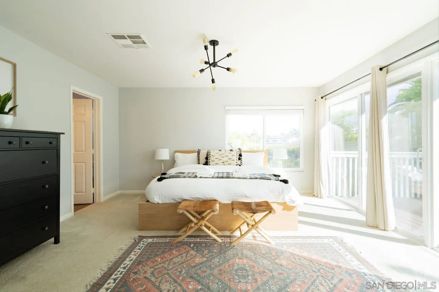 5238 La Jolla Boulevard San Diego, CA 92037 - Photo 30 of 46 a spacious bedroom with a bed and window