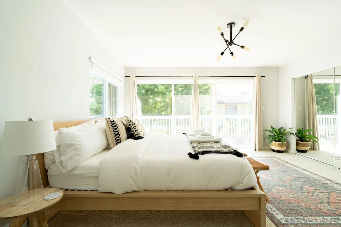 5238 La Jolla Boulevard San Diego, CA 92037 - Photo 31 of 46 a bedroom with a bed and a large window