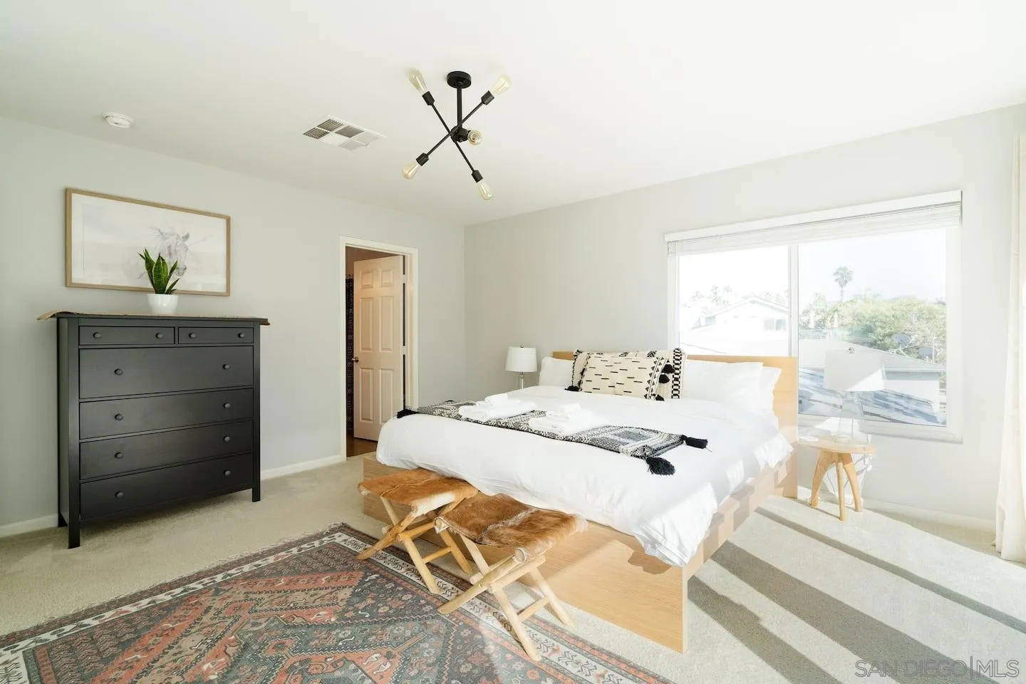 5238 La Jolla Boulevard San Diego, CA 92037 - Photo 33 of 46 a bedroom with a bed and a window