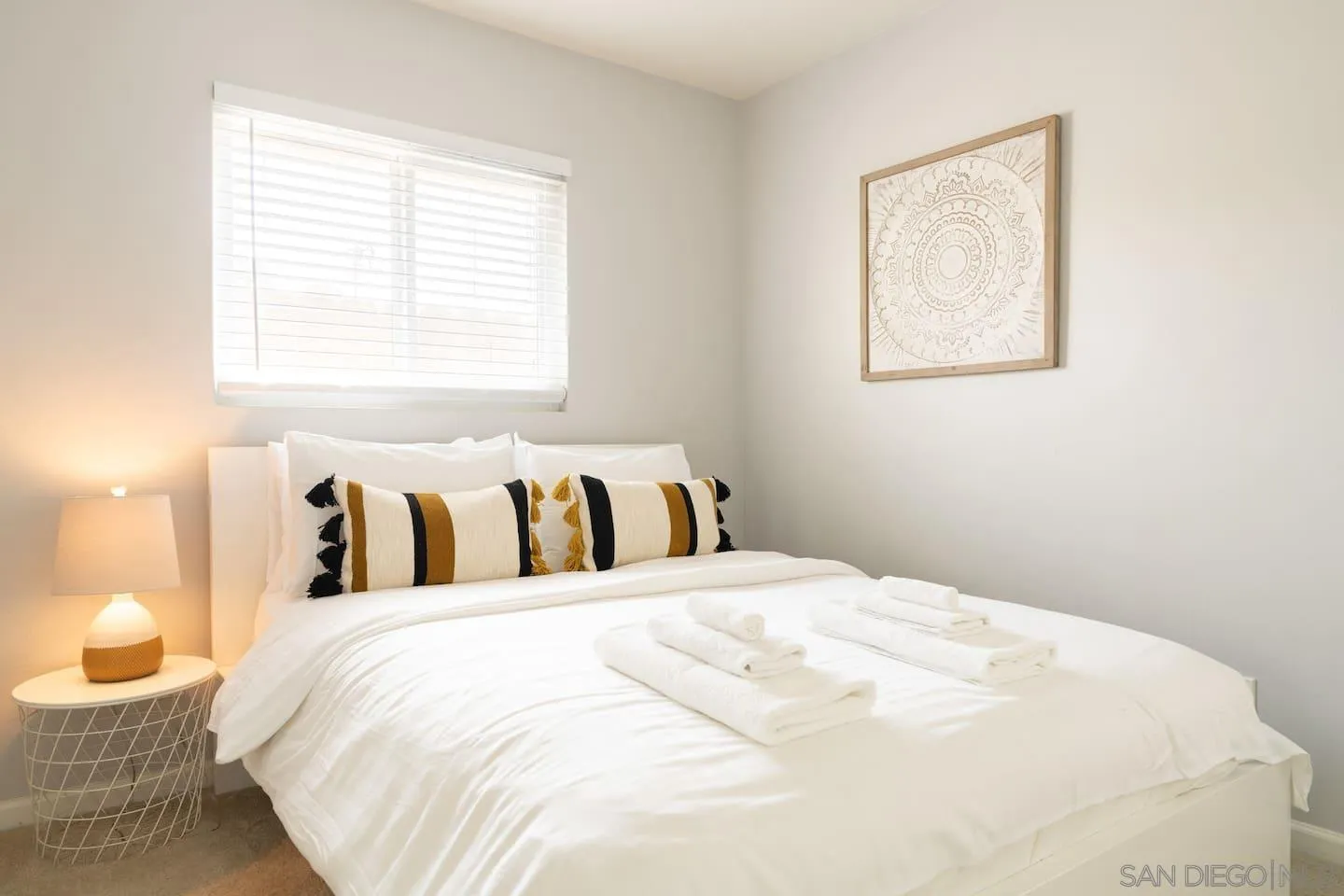 5238 La Jolla Boulevard San Diego, CA 92037 - Photo 38 of 46 a bed room with a bed and a painting