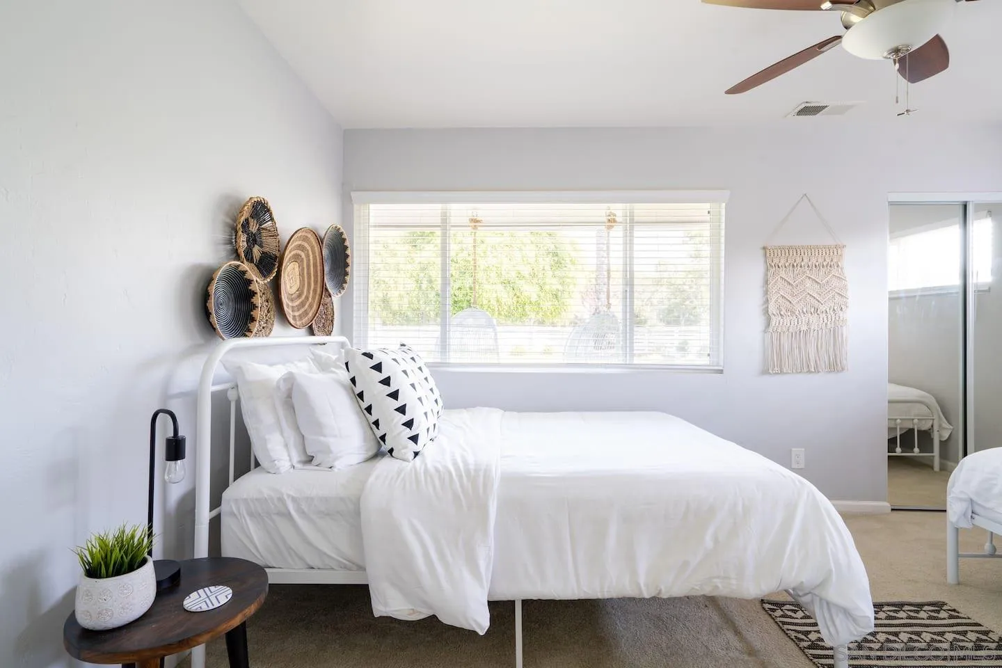 5238 La Jolla Boulevard San Diego, CA 92037 - Photo 39 of 46 a bedroom with a bed and a large window