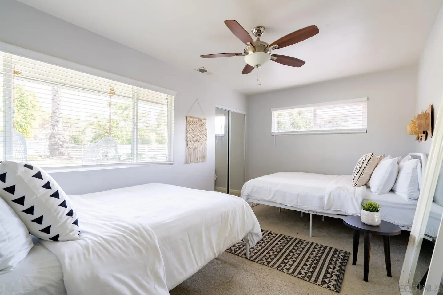 5238 La Jolla Boulevard San Diego, CA 92037 - Photo 40 of 46 a bedroom with a bed couch and window
