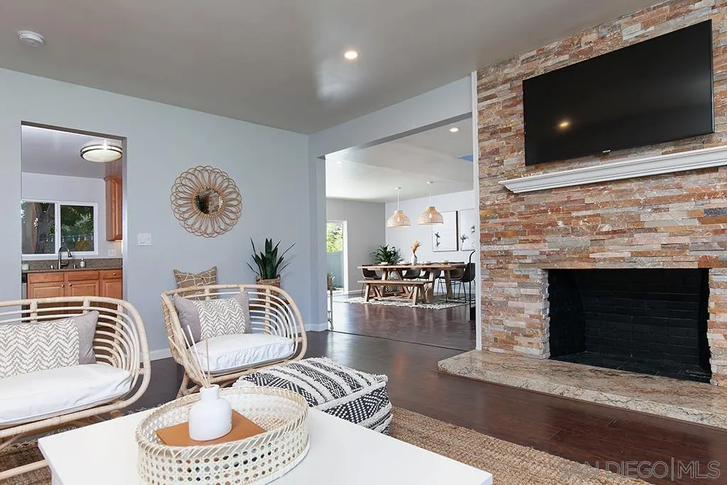 5238 La Jolla Boulevard San Diego, CA 92037 - Photo 9 of 46 a living room with furniture a flat screen tv and a fireplace