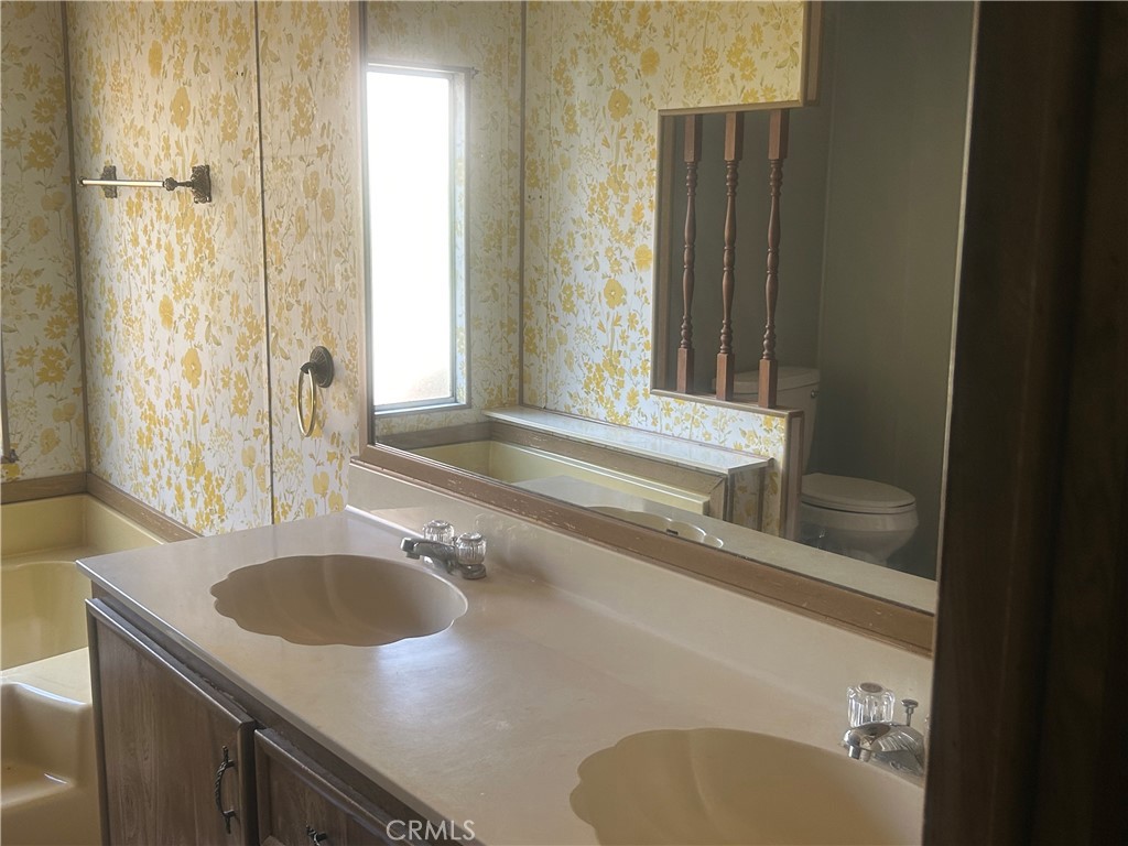 6773 Sayre Avenue Nice, CA 95464 - Photo 13 of 16 a bathroom with a sink and a mirror