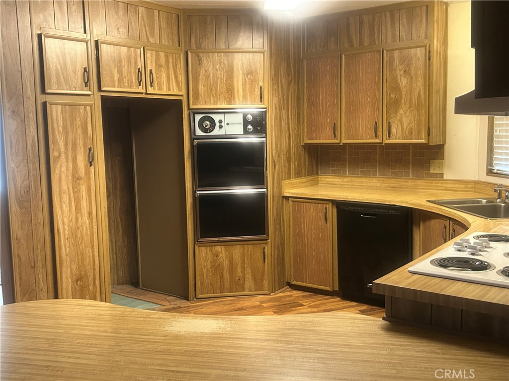 6773 Sayre Avenue Nice, CA 95464 - Photo 6 of 16 a view of a kitchen with stainless steel appliances granite countertop a refrigerator and a sink