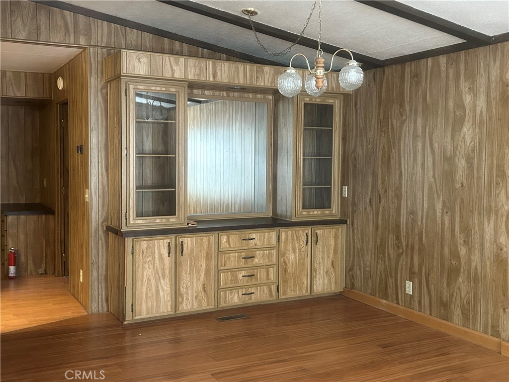 6773 Sayre Avenue Nice, CA 95464 - Photo 10 of 16 a view of a hallway with wooden floor and staircase