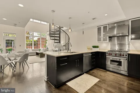 a kitchen with counter top space cabinets and appliances