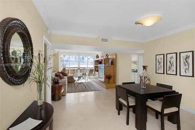 a living room with furniture a rug and a chandelier