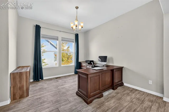 a view of workspace with wooden floor