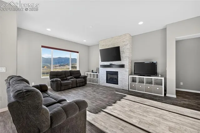a living room with furniture and a flat screen tv