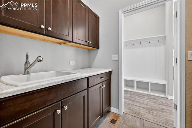 a kitchen with a sink and cabinets