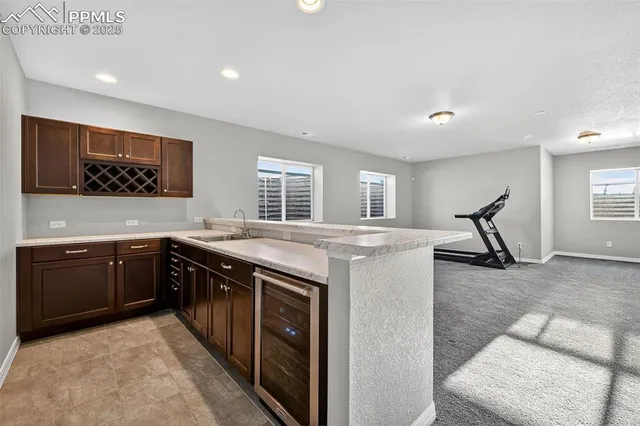 a kitchen with stainless steel appliances granite countertop a stove and a sink