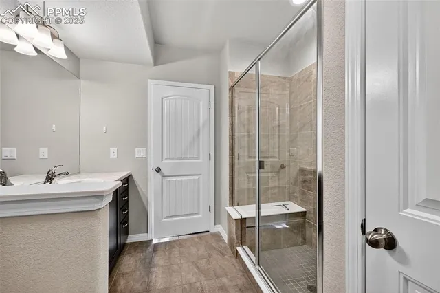 a bathroom with a double vanity sink and mirror