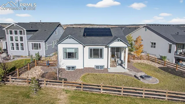 a view of a house with backyard porch and sitting area