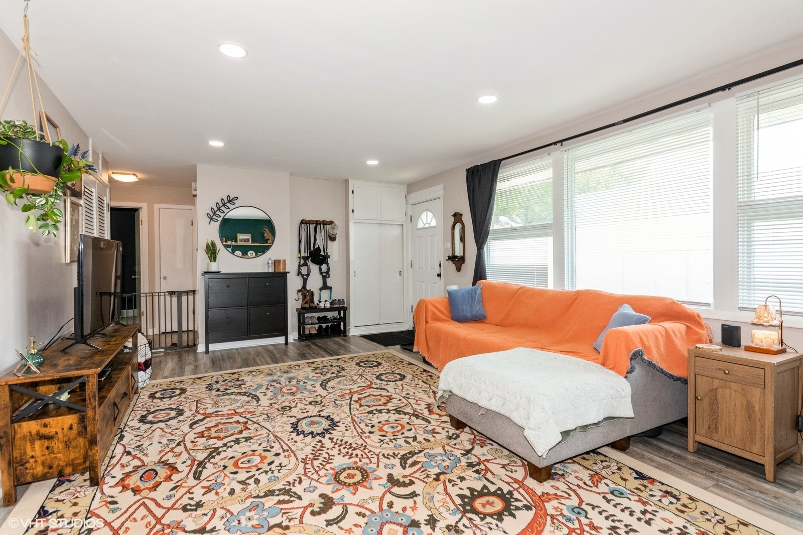 4346 Maple Avenue Brookfield, IL 60513 - Photo 4 of 15 a living room with furniture a flat screen tv and a refrigerator