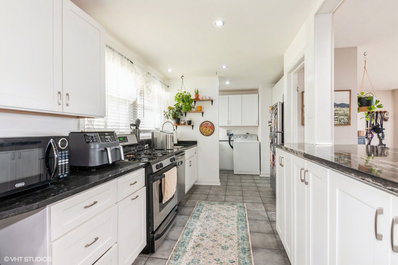 4346 Maple Avenue Brookfield, IL 60513 - Photo 8 of 15 a kitchen with stainless steel appliances granite countertop a sink a stove and a refrigerator