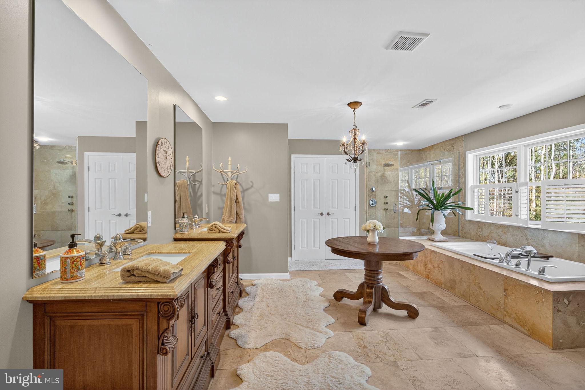 700 Battle Mountain Road Amissville, VA 20106 - Photo 35 of 64 a bathroom with a sink double vanity and a bathtub