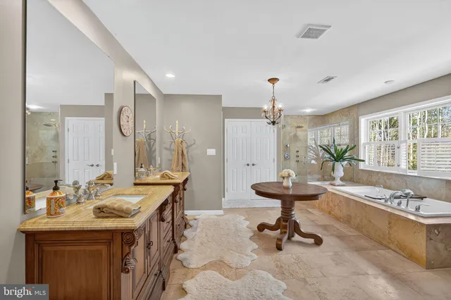 a en suite bathroom with a sink and mirror