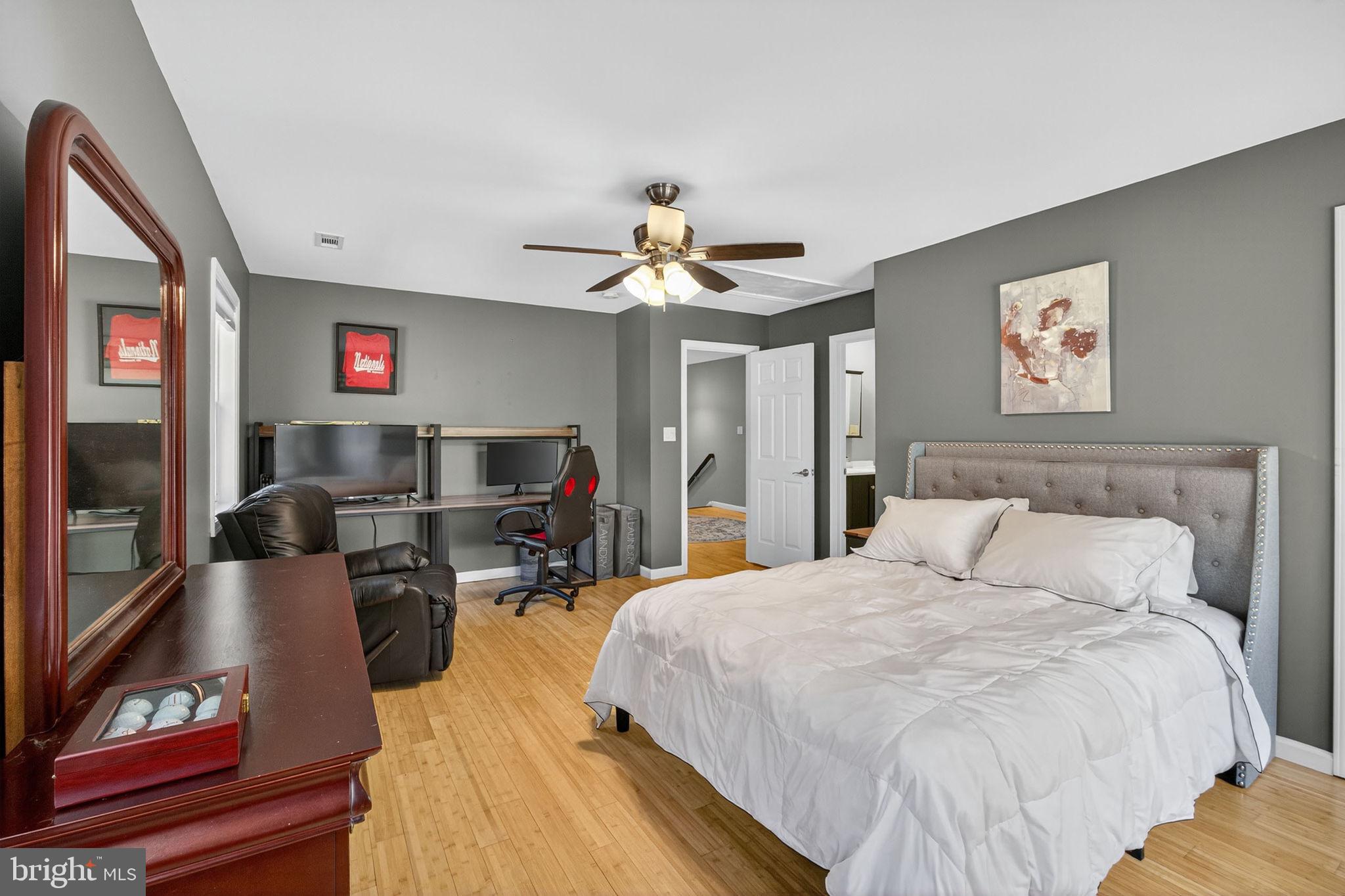 700 Battle Mountain Road Amissville, VA 20106 - Photo 40 of 64 a bedroom with a bed and a chandelier