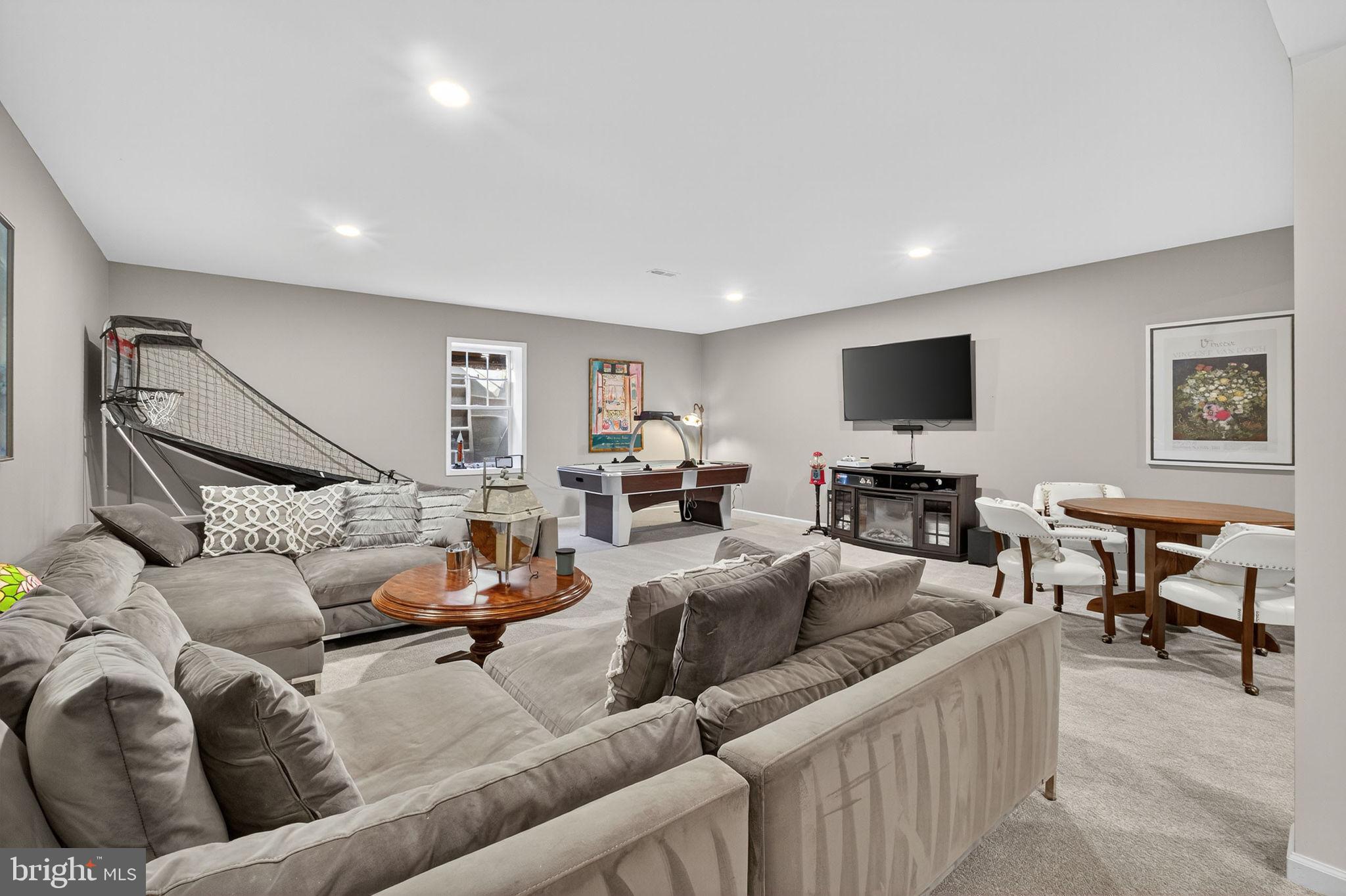 700 Battle Mountain Road Amissville, VA 20106 - Photo 45 of 64 a living room with furniture and a flat screen tv with wooden floor