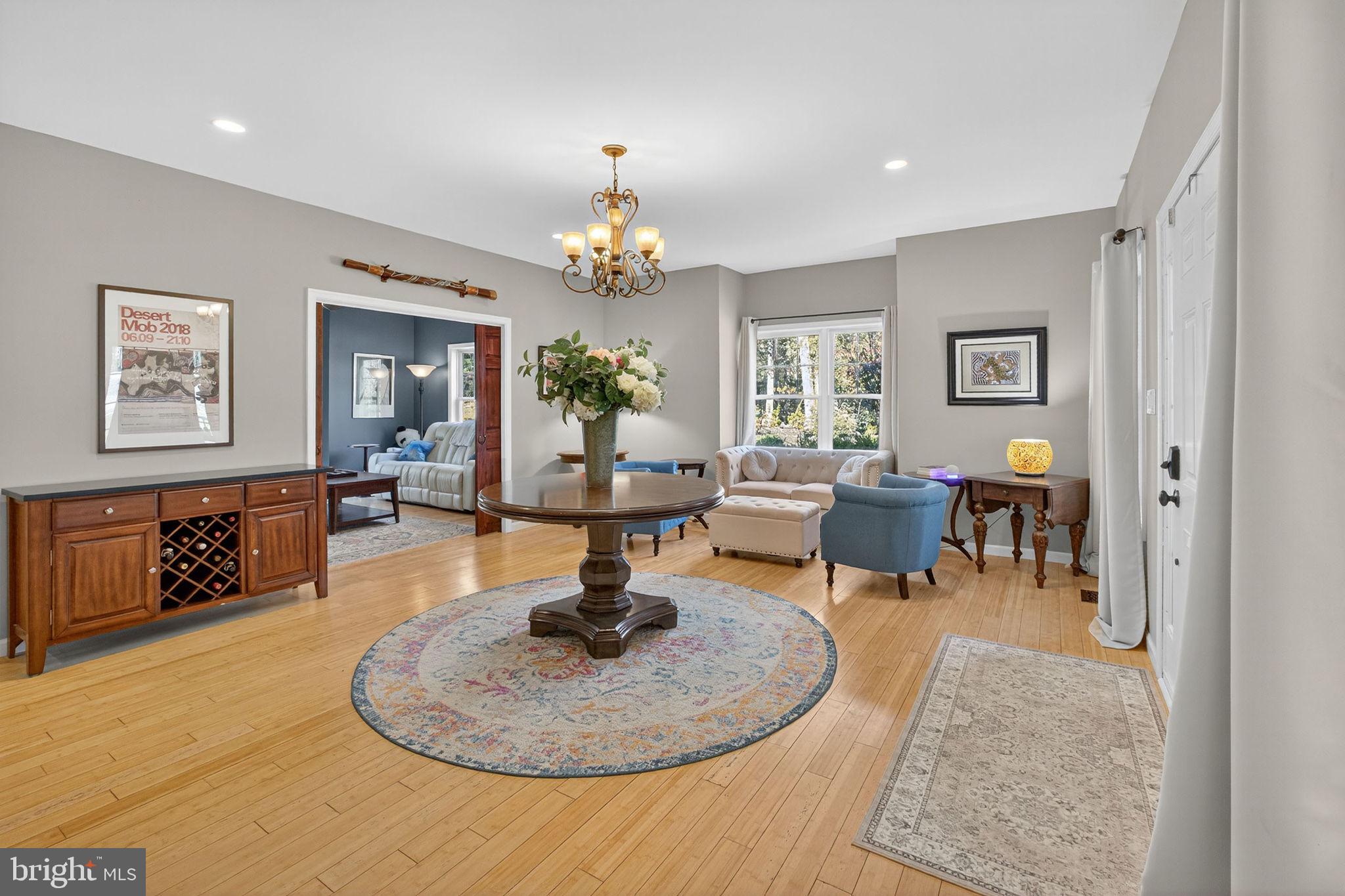700 Battle Mountain Road Amissville, VA 20106 - Photo 6 of 64 a living room with furniture and a chandelier