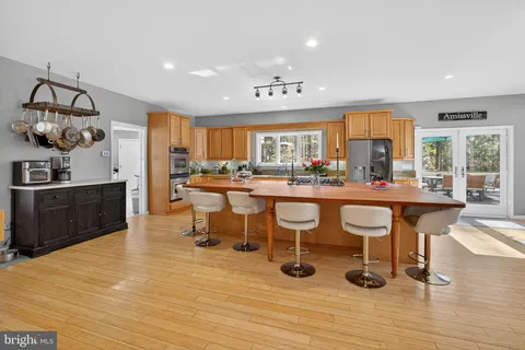 a kitchen with stainless steel appliances granite countertop a stove and a refrigerator