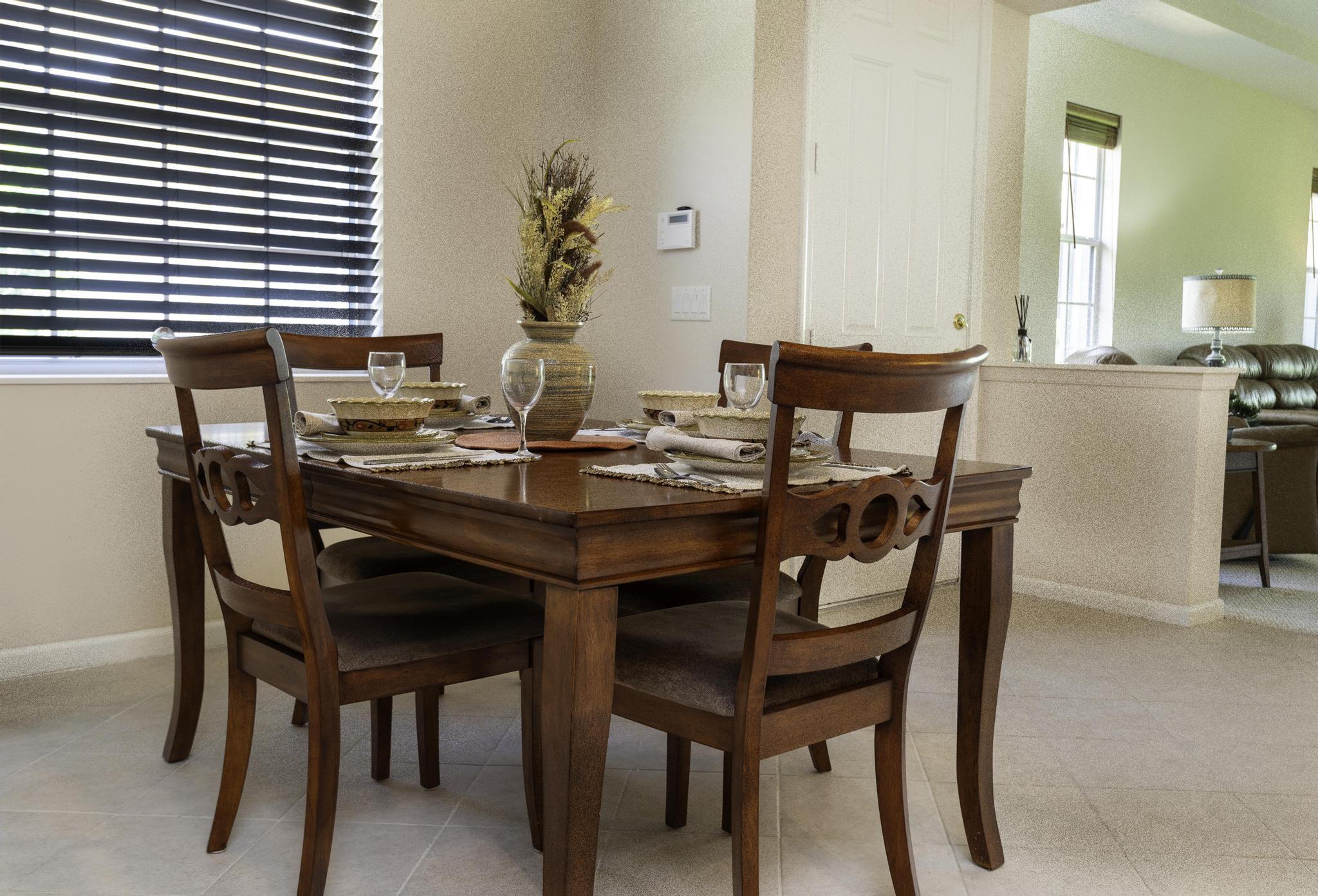 511 Northwest Red Pine Way Jensen Beach, FL 34957 - Photo 26 of 60 a view of a dining room with furniture and window