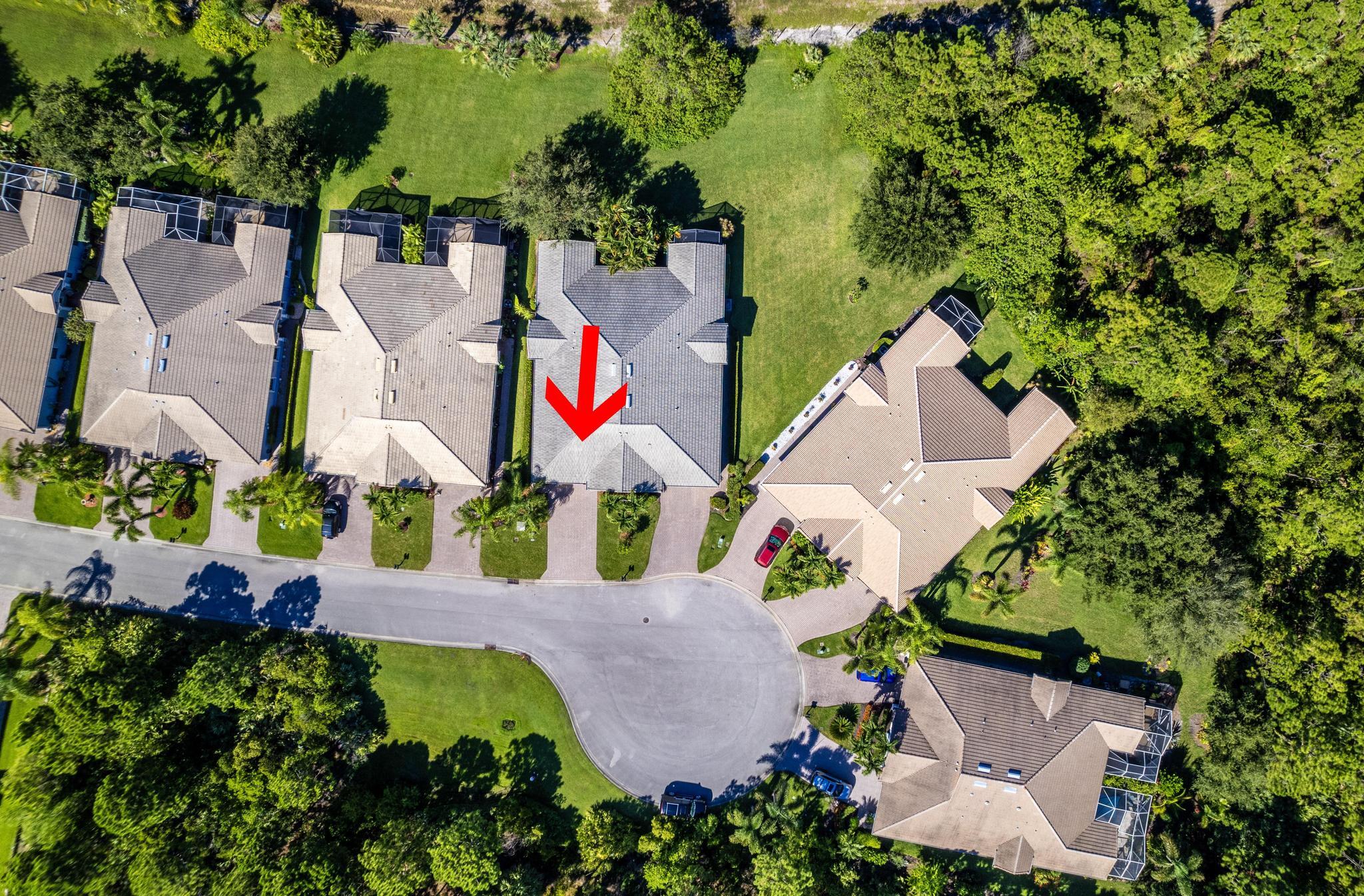 511 Northwest Red Pine Way Jensen Beach, FL 34957 - Photo 36 of 60 an aerial view of a houses with yard