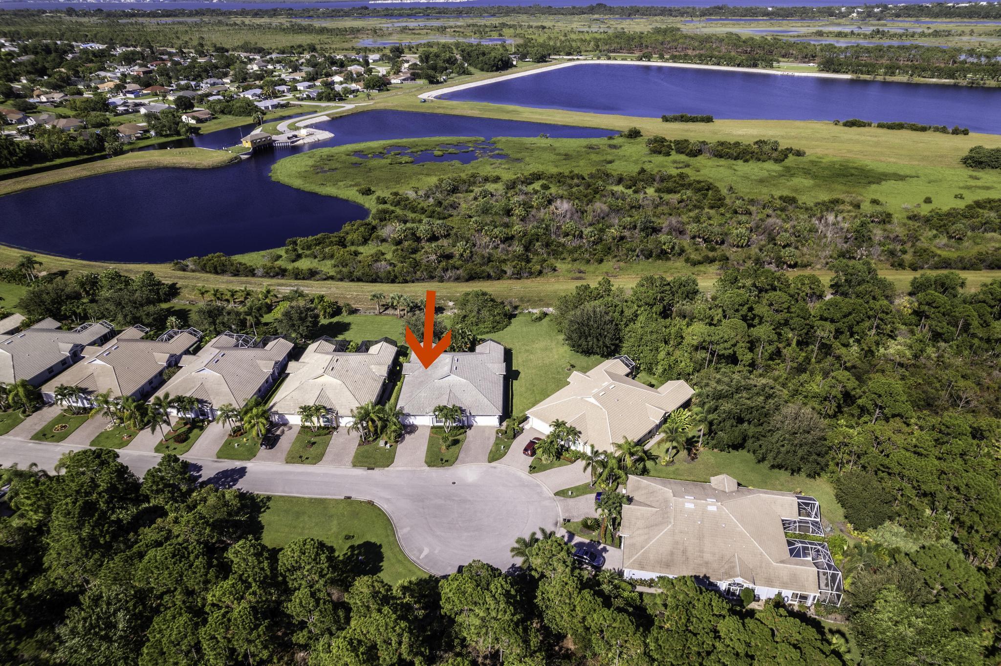 511 Northwest Red Pine Way Jensen Beach, FL 34957 - Photo 37 of 60 an aerial view of residential houses with outdoor space