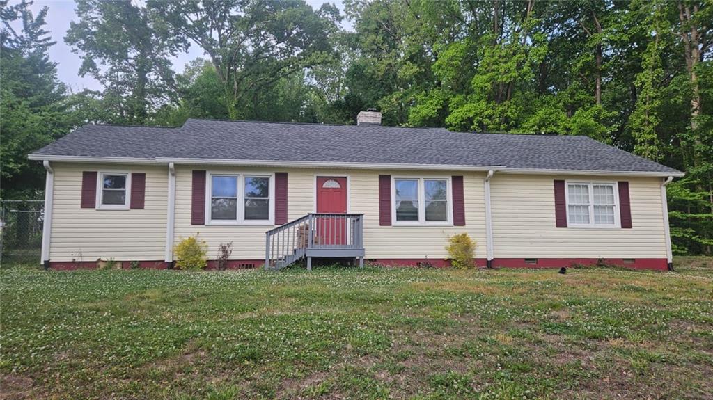 471 Perkins Circle Canton, GA 30115 - Photo 1 of 20 a front view of house with yard and trees in the background
