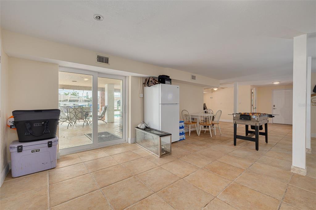 8100 Brighton Drive Port Richey, FL 34668 - Photo 19 of 68 a living room with furniture and a flat screen tv