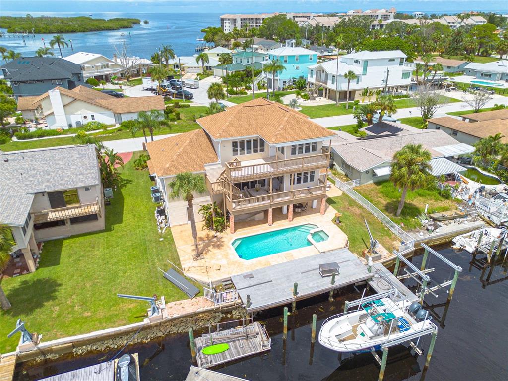 8100 Brighton Drive Port Richey, FL 34668 - Photo 2 of 68 an aerial view of residential houses with outdoor space and swimming pool