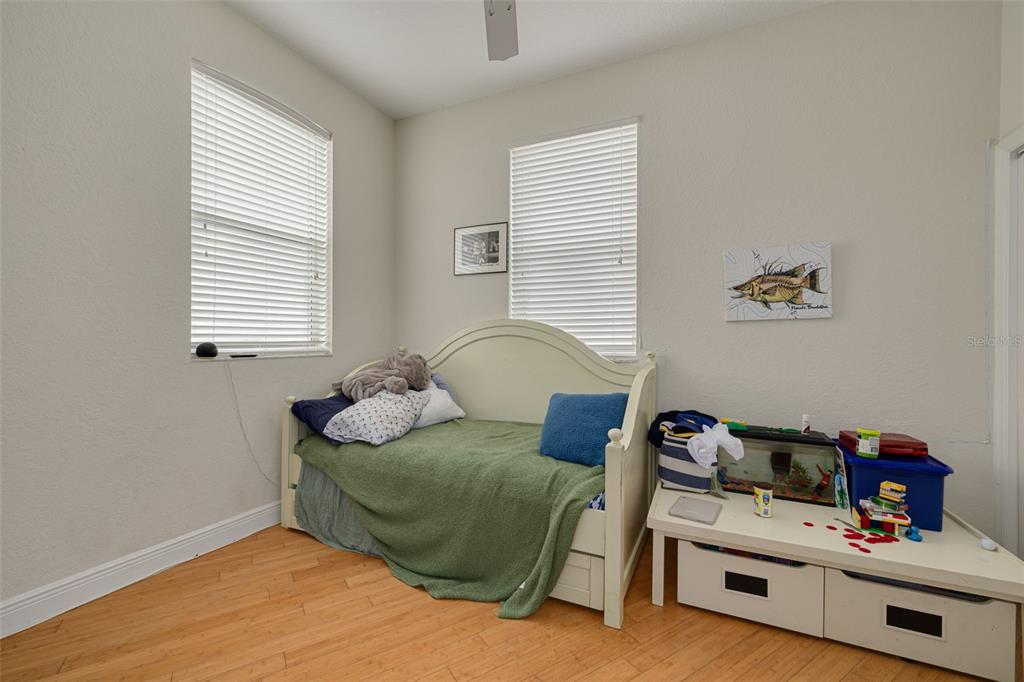 8100 Brighton Drive Port Richey, FL 34668 - Photo 28 of 68 a bedroom with bed and a window