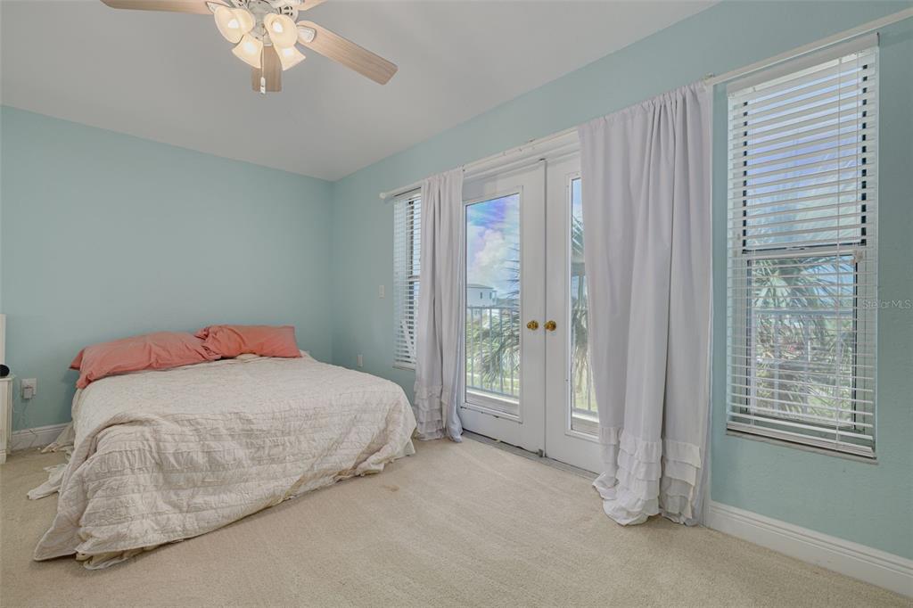 8100 Brighton Drive Port Richey, FL 34668 - Photo 30 of 68 a bedroom with a bed and a window