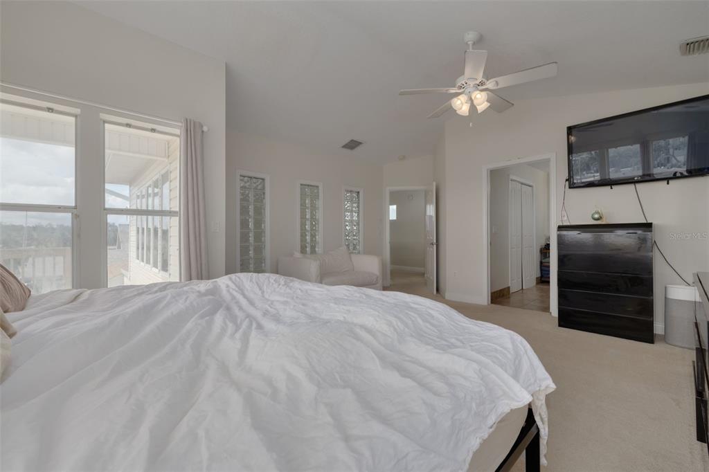 8100 Brighton Drive Port Richey, FL 34668 - Photo 40 of 68 a bedroom with a bed and a television