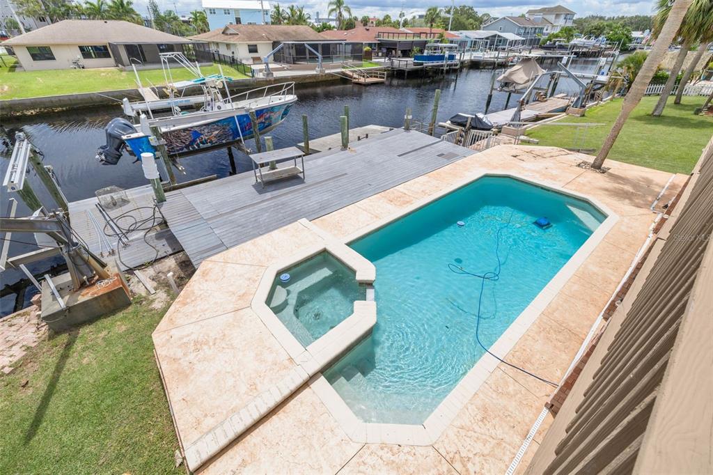 8100 Brighton Drive Port Richey, FL 34668 - Photo 44 of 68 a view of a swimming pool with lounge chairs