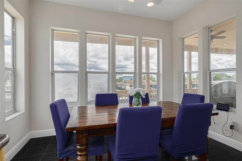 8100 Brighton Drive Port Richey, FL 34668 - Photo 47 of 68 a view of a dining room with furniture window and outside view