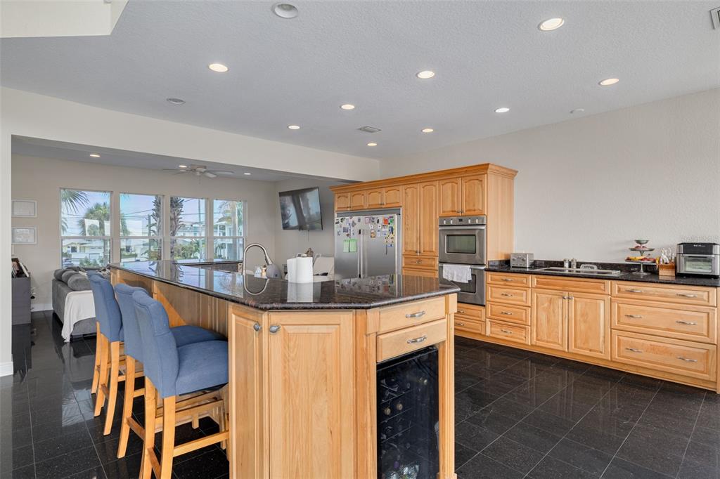 8100 Brighton Drive Port Richey, FL 34668 - Photo 51 of 68 a kitchen that has a table and chairs in it