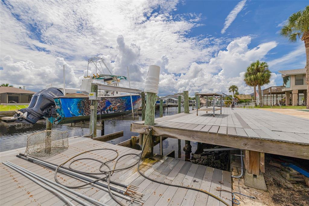 8100 Brighton Drive Port Richey, FL 34668 - Photo 6 of 68 a view of a dinning tables and chairs in the patio