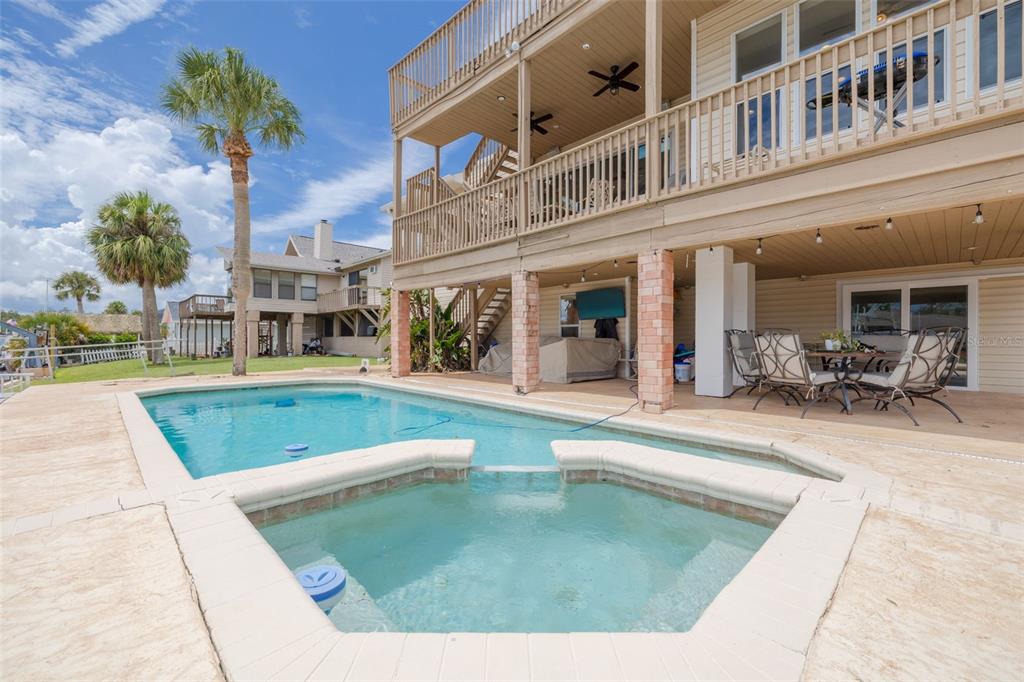 8100 Brighton Drive Port Richey, FL 34668 - Photo 9 of 68 a view of a building with a swimming pool