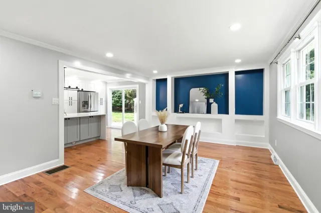 a view of a dining room with furniture and window