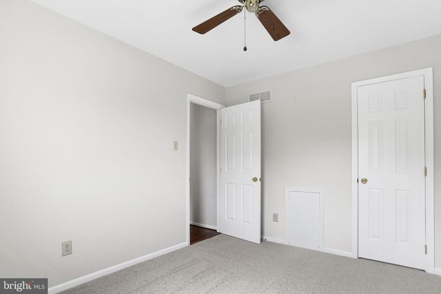a bathroom with a shower a sink and a mirror