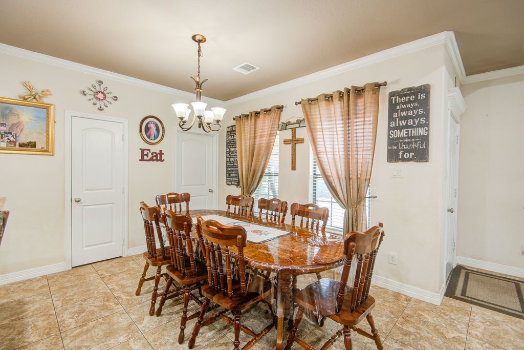 24910 Farm To Market 2004 Angleton, TX 77515 - Photo 12 of 50 a view of a dining room with furniture and window