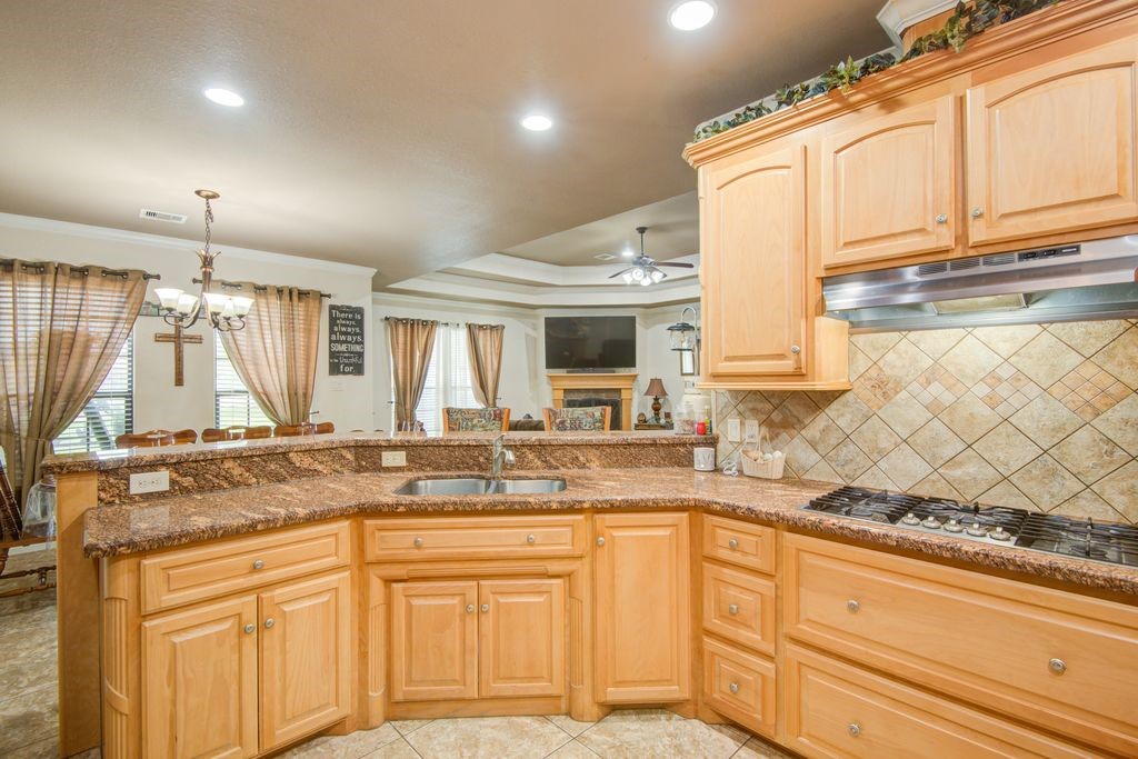 24910 Farm To Market 2004 Angleton, TX 77515 - Photo 14 of 50 a kitchen with sink cabinets and window