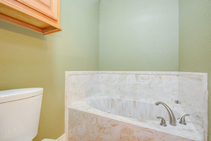 24910 Farm To Market 2004 Angleton, TX 77515 - Photo 24 of 50 a bathroom with a bathtub