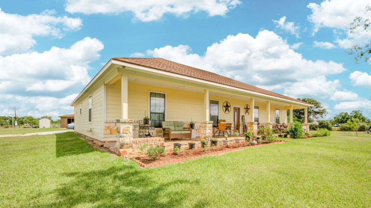 24910 Farm To Market 2004 Angleton, TX 77515 - Photo 3 of 50 a view of a house with a big yard