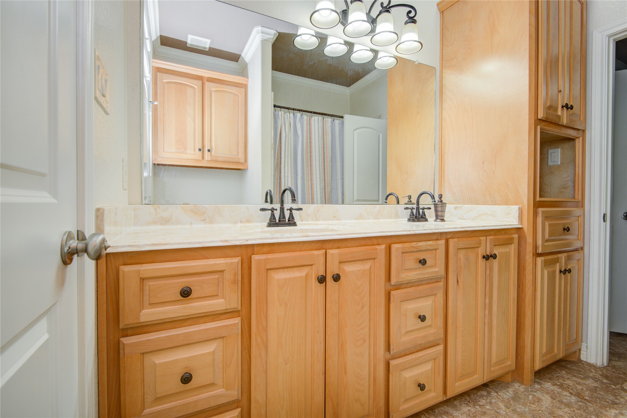 24910 Farm To Market 2004 Angleton, TX 77515 - Photo 34 of 50 a bathroom with a sink double vanity and a mirror