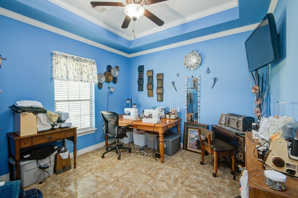 24910 Farm To Market 2004 Angleton, TX 77515 - Photo 36 of 50 a workspace with wooden floor and a window